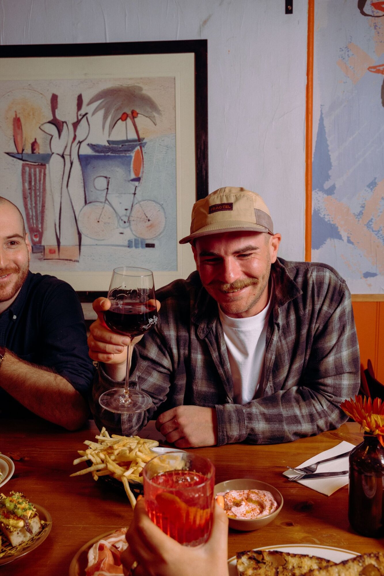 Friends sharing drinks and food at Nowhere Bar